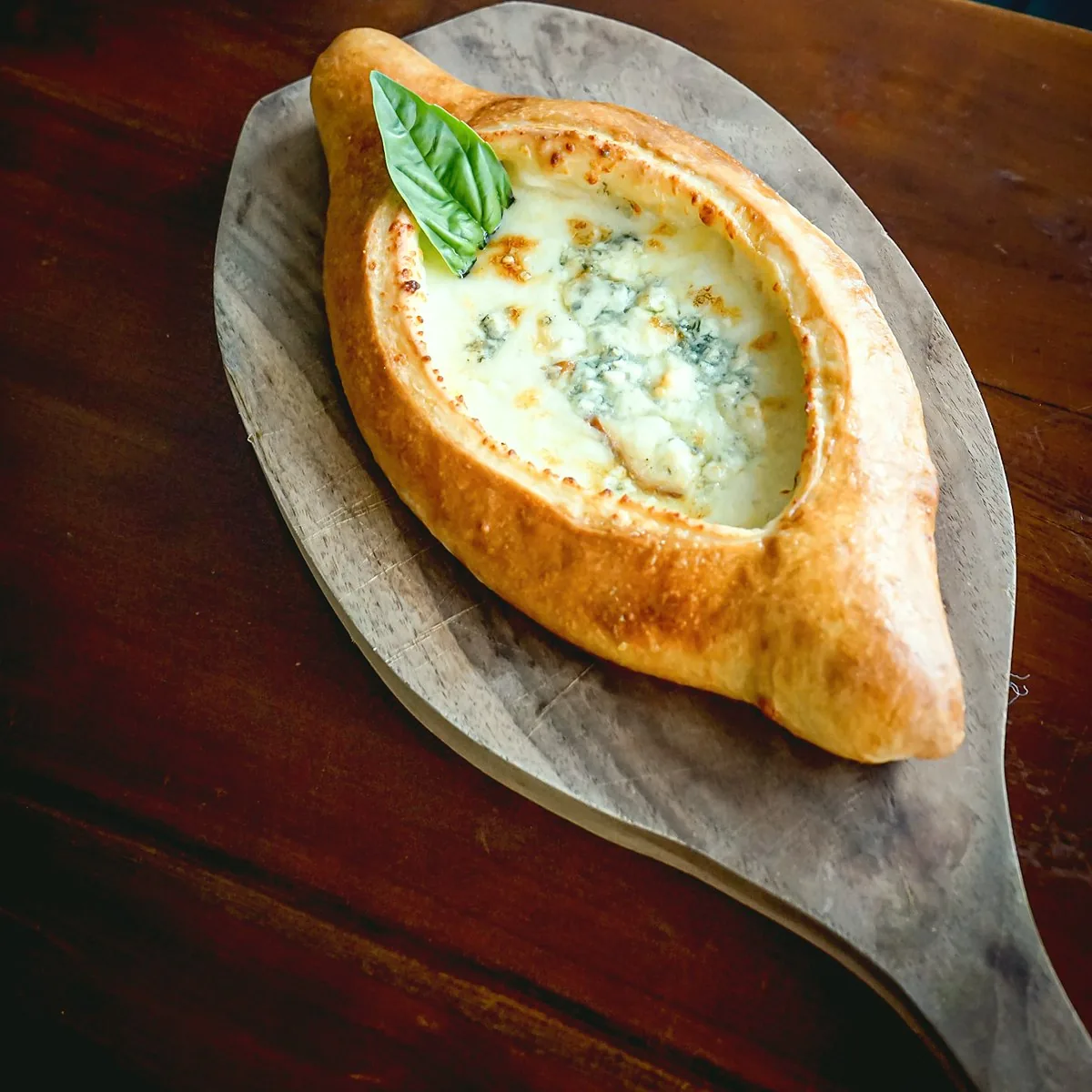 Khachapuri «Four cheese» at Tarragon Georgian restaurant, Uluwatu Bali