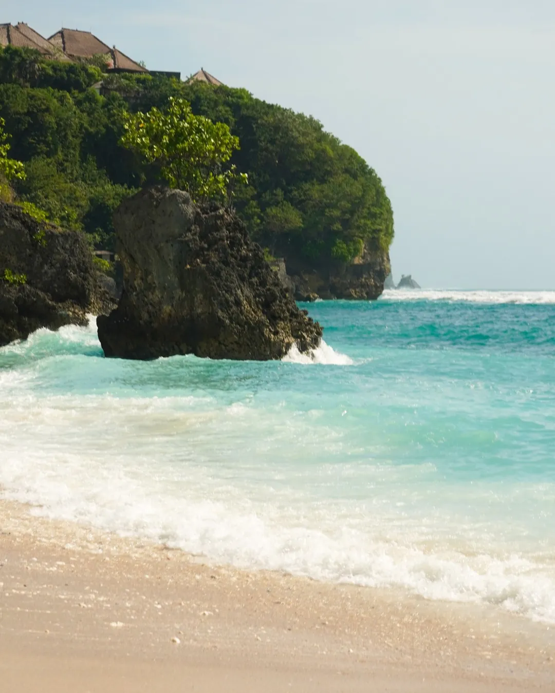 Waves breaking on the rocks at Padang Padang beach, Uluwatu, Bali