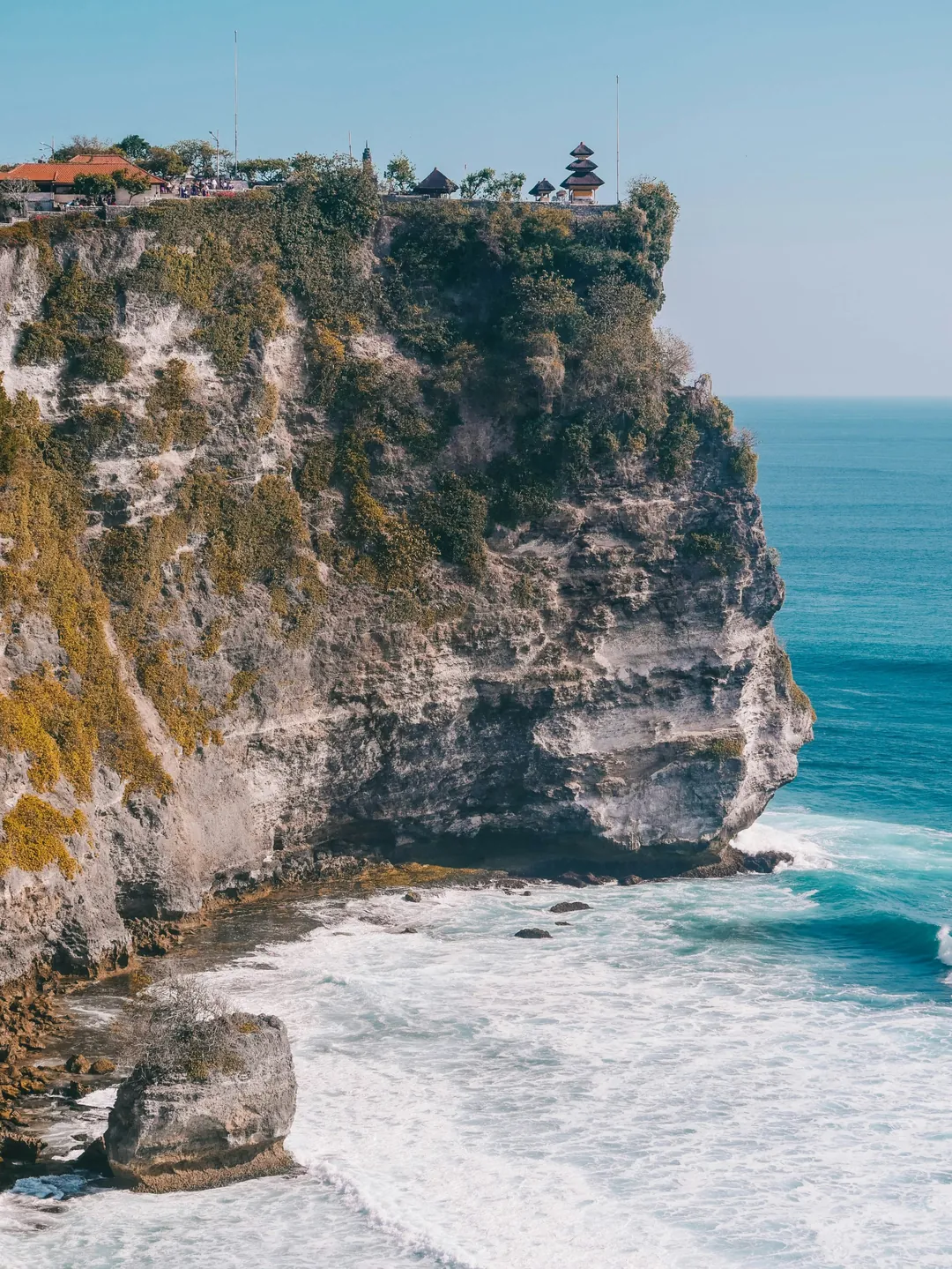 Uluwatu Temple on top of a limestone cliff above the Indian Ocean, Bali